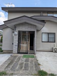 a house with a revolving door in front of it at T&T Fujiyama MC2 in Iiyama