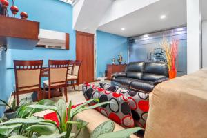 a living room with a couch and a table at Casa Magi in Bogotá
