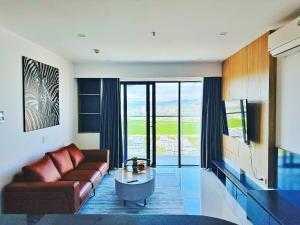 a living room with a couch and a table at Căn hộ Vip 2Phòng ngủ - Huế Ơi 3 in Hue