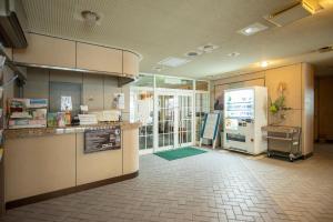 a kitchen with a counter and a refrigerator at Fewdays Condominium301 in Sapporo