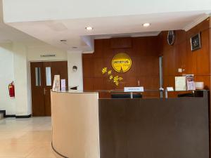 a lobby of a hospital with a reception desk at Hortus Inn in Tawangmangu