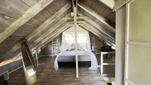 a bedroom with a bed in the attic at Moorea Fare Korail in Temae +22 photos