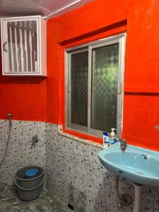 a bathroom with a toilet and a sink at Blue Valley Escape in Darjeeling +13 photos