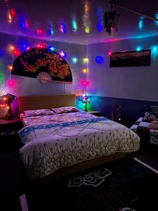 a bedroom with a bed with lights on it at Blue Valley Escape in Darjeeling
