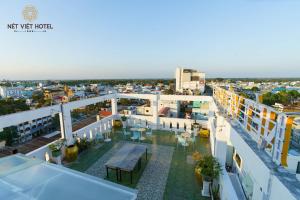 an aerial view of the rooftop of a building at Nét Việt House Hotel Market & Bridge Centre Soc Trang in Soc Trang