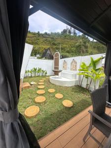 a view of a garden with a table and chairs at Naima 1 in Bandung