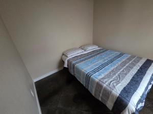 a small bedroom with a bed in the corner at Special Deal on Booking Unit-558 in Paris