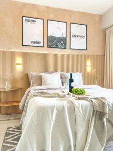 a bedroom with a bed with a table with wine glasses at Mi Casa de Baguio by North Sierra in Baguio