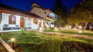 an exterior view of a church at night at La Roche Hotel Sigiriya in Sigiriya
