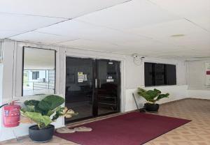 a room with two potted plants in a room at Hotel Green Town Port Dickson in Port Dickson +61 photos
