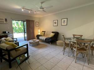 a living room with a couch and a table at Liana 4 Beach Lovers All at your finger tips in Mission Beach