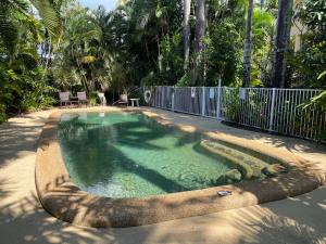 a swimming pool with an elephant design in a yard at Liana 4 Beach Lovers All at your finger tips in Mission Beach