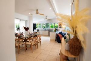 a dining room and kitchen with a table and chairs at Tide Pool Ocean Front Full house in South Mission Beach