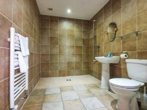 a bathroom with a toilet and a sink at The Stables - Uk7791 in Milton of Auchinhove