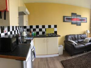 a kitchen and living room with a couch at Uk7522 - Science in Dallavich