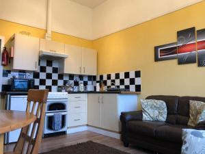 a living room with a couch and a kitchen at Uk7522 - Science in Dallavich