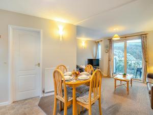 a dining room with a table and chairs at 12 Mount Brioni in Downderry