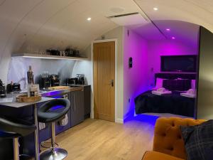 a room with a purple room with a bed at Dunfion - Uk7835 in Brodick