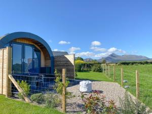 a house with a fence around a garden at Dunfion - Uk7835 in Brodick +8 photos