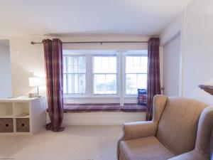 a living room with a couch and a window at 7A - Uk7350 in Edinburgh