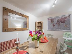 a dining room with a table and a mirror at 7A - Uk7350 in Edinburgh