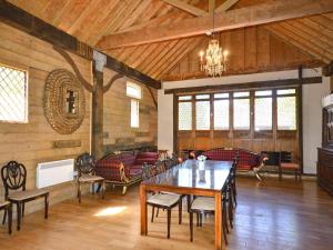 a large dining room with a table and chairs at The Timber Store in Hardham