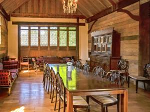 a large dining room with a table and chairs at The Timber Store in Hardham