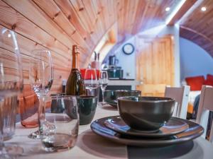 a table with a bottle of wine and glasses on it at Chestnut-Uk7586 in Stewarton