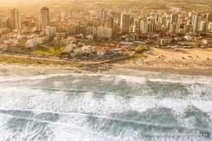 an aerial view of a beach and a city at Dunas Praia Hotel in Torres