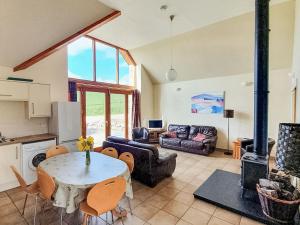 a living room with a table and a couch at The Byre - Uk7790 in Milton of Auchinhove
