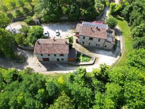 an aerial view of a house in the trees at Agriturismo Corte Dei Mori in Brisighella +28 photos
