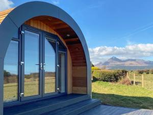 an arched entry to a house with a view of mountains at Dhunan - Uk7836 in Brodick +7 photos