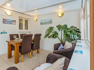 a dining room with a table and chairs at The Garden Flat in Torquay