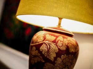 a close up of a vase with a lamp at Edenville in Girthon +13 photos