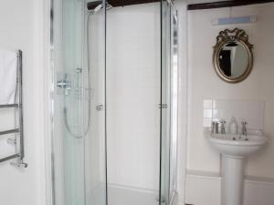 a bathroom with a shower and a sink at The Coach House - Ukc4691 in Kilkhampton