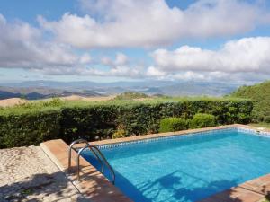 a swimming pool with a view of the mountains at Belvilla by OYO Casa Torcalillos in La Joya
