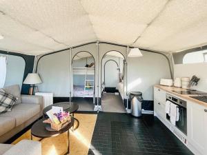 a living room with a tent with a couch and a table at Otter - Ukc8189 in Dolau