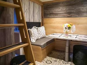 a small room with a table with a vase of flowers at Hillside Lodge - Ukc8191 in Dolau