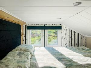 a bedroom with a large bed and a window at Hillside Lodge - Ukc8191 in Dolau +6 photos