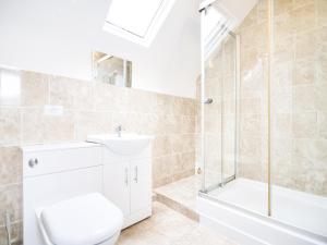 a bathroom with a toilet and a sink and a shower at Cottage 2 - Ukc3179 in York