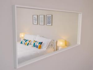 a mirror reflection of a bed in a white room at Number Four - Ukc4966 in Tawstock +19 photos