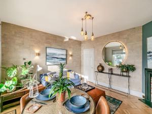 a living room with a couch and a table at 17 Mount Brioni in Downderry