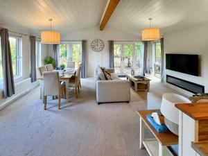 a living room with a couch and a table at The Ardle in Crieff