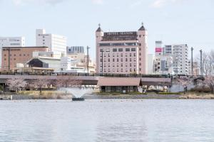 a large body of water with a city in the background at Mito Hotel Season in Mito