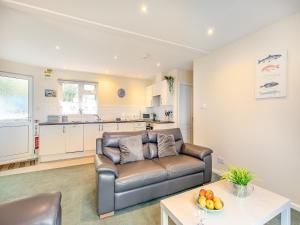 a living room with a couch and a table at 11 Mount Brioni - Ukc5345 in Torpoint