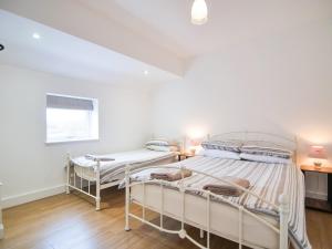 two bunk beds in a white room with a window at Cottage 7 - Ukc3184 in York