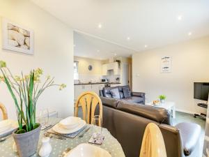 a living room with a couch and a table at 11 Mount Brioni - Ukc5345 in Torpoint