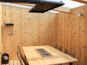 a dining room with a wooden table and a hood at Knockan - Ukc6026 in Newmill