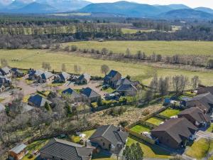 an aerial view of a residential neighborhood with houses at Cairngorm View - Ukc5052 in Aviemore