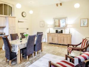 a dining room with a table and chairs at The Amherst House in Bury Saint Edmunds